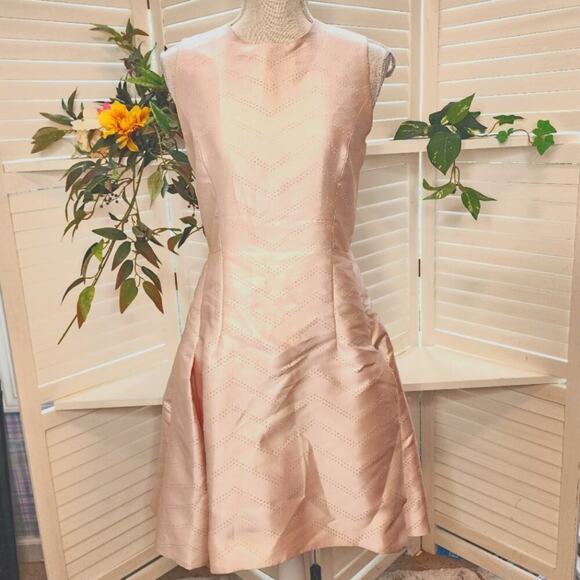 ALEXIS MED PLEATED PINHOLE BLUSH PEPLUM DRESS - Picture 1 of 9